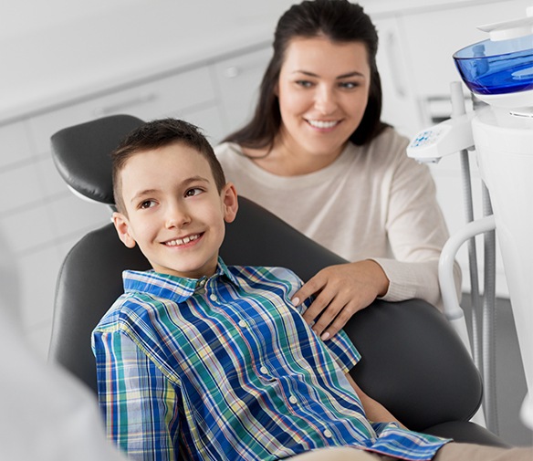 Young boy in dental chair for children's dentistry visit
