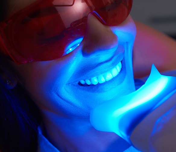 Patient receiving in office teeth whitening